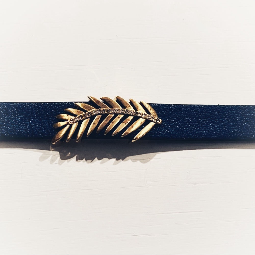 Navy leather bracelet with gold jewel encrusted feather charm